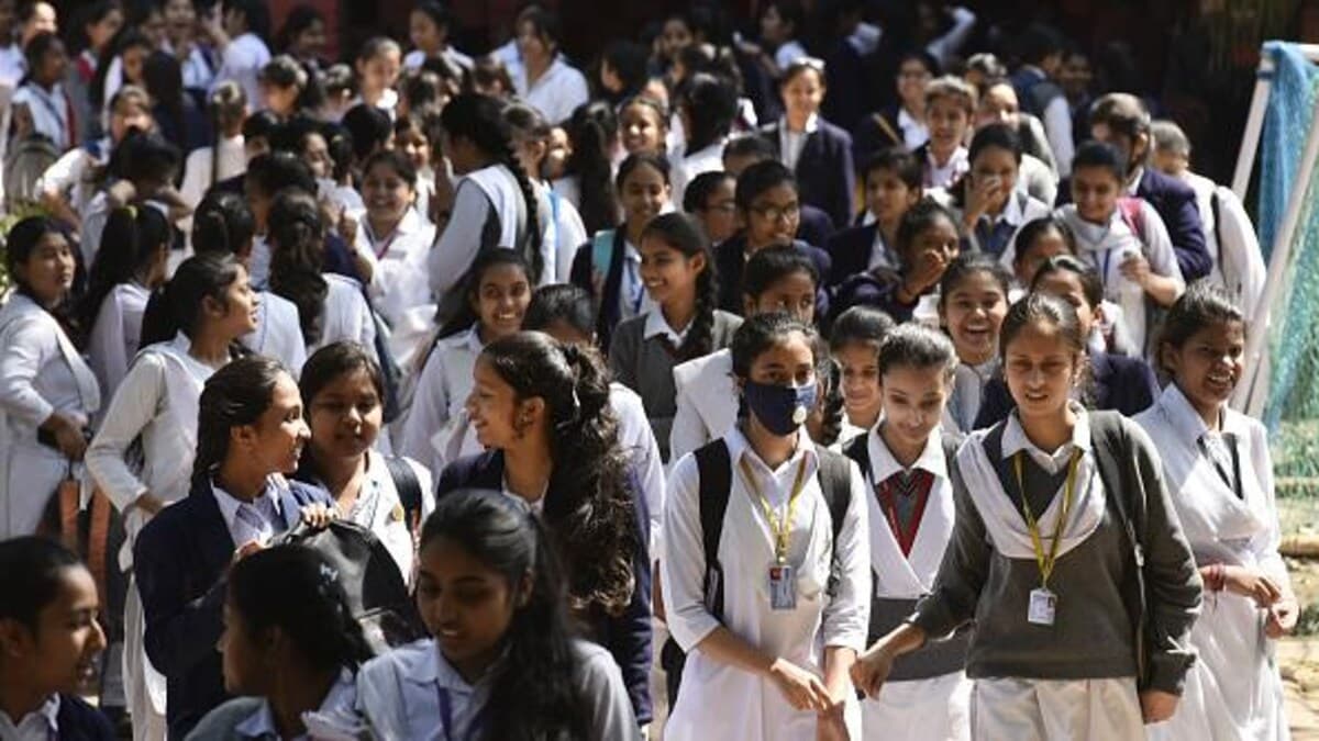 Secondary school students walking together outside their school